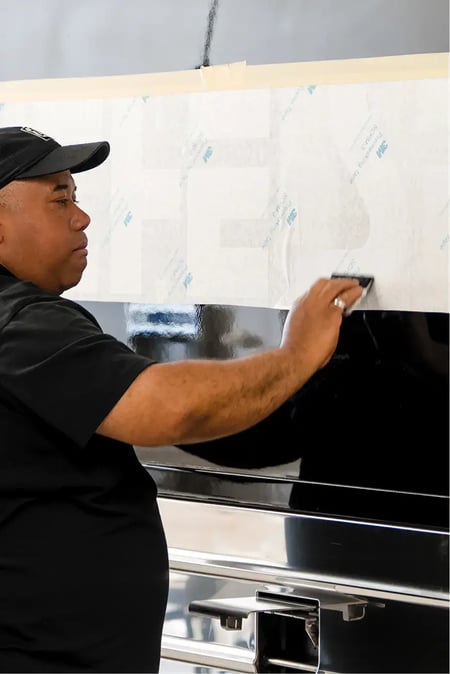3M certified bus graphics being installed on motorcoach