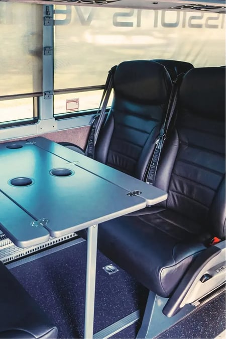 Van Hool TDX25E electric double deck motorcoach passenger table seating