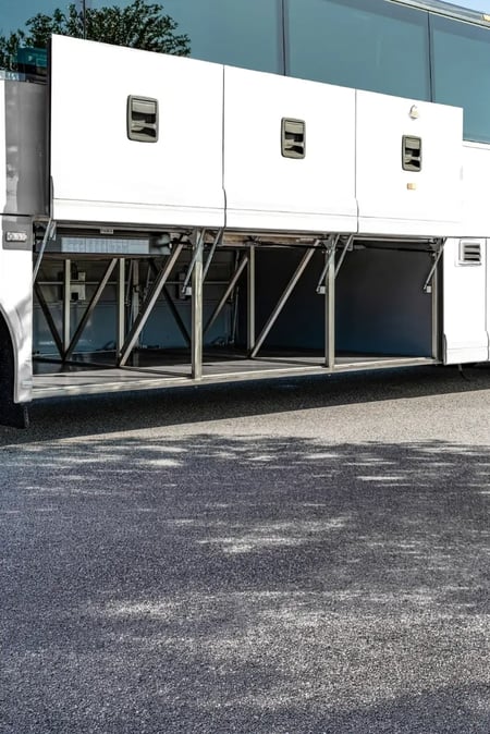 Open underfloor luggage bay on the Van Hool CX35