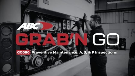 ABC Companies technician performing a preventive maintenance inspection in a Van Hool motorcoach engine compartment