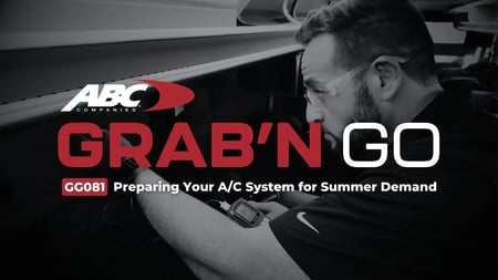 ABC Companies technician inspecting a Van Hool motorcoach air-conditioning system for summer maintenance